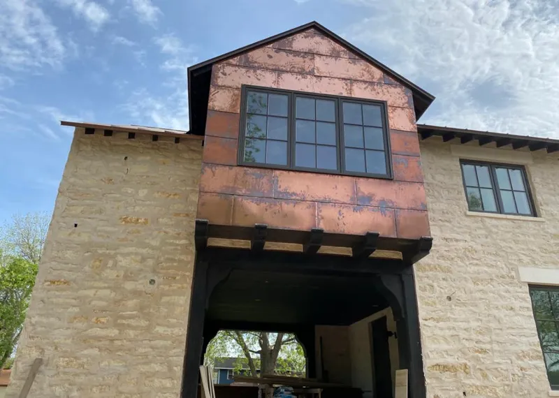 Copper metal panel facade on a stone building for Metal Roof Coating in Northgate